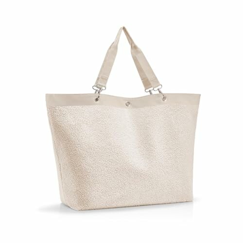 Sac fourre-tout beige avec sangles.